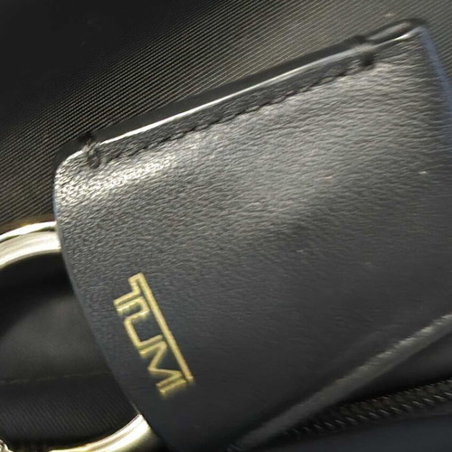Tumi backpack used, black with gold details