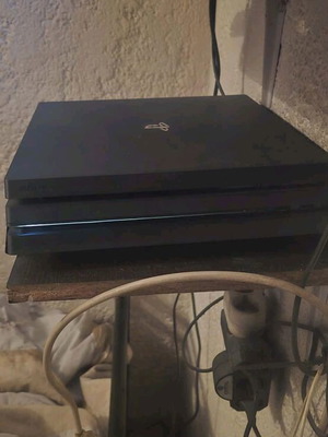 PlayStation 4 Pro 1TB like new with 2 controllers (red and black)