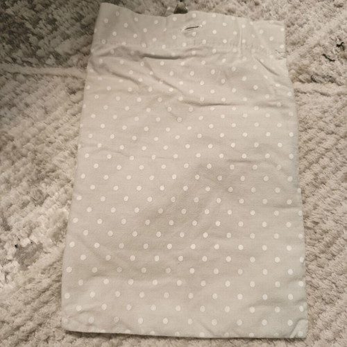 Nursing cover with storage pouch used