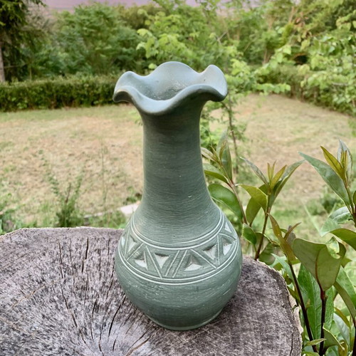 Handmade ceramic vase with carved geometric patterns, like new
