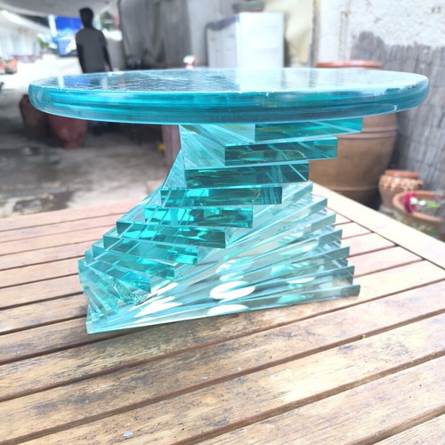 Round coffee table used with glass spiral base