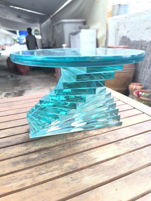 Round coffee table used with glass spiral base