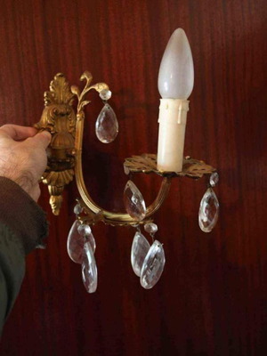 Brass wall light used with decorative crystals
