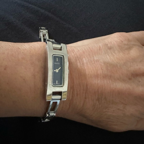 Gucci women's watch like new with silver metal bracelet