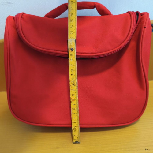 Toiletry bag used, red, practical and spacious travel case