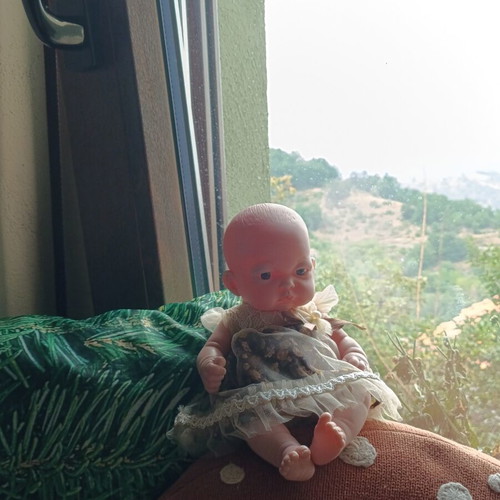 Doll with vintage dress