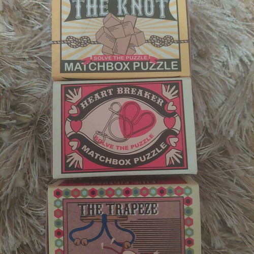 Matchbox puzzle set new with Heart, Knot, Trapeze