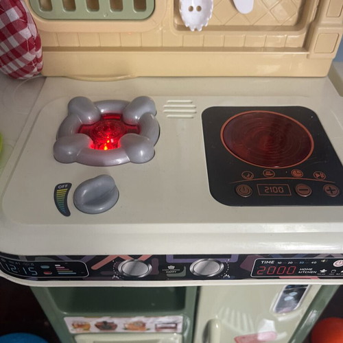 Children's play kitchen with many accessories