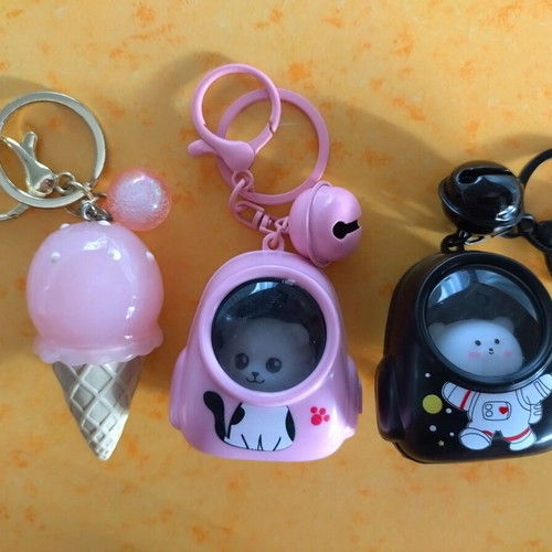 Illuminated keychains set of 3 like new, black and pink