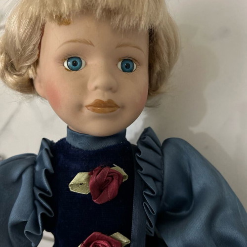 Porcelain doll like new vintage with blue satin dress