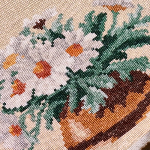 Vintage needlepoint with embroidered daisy bouquet used