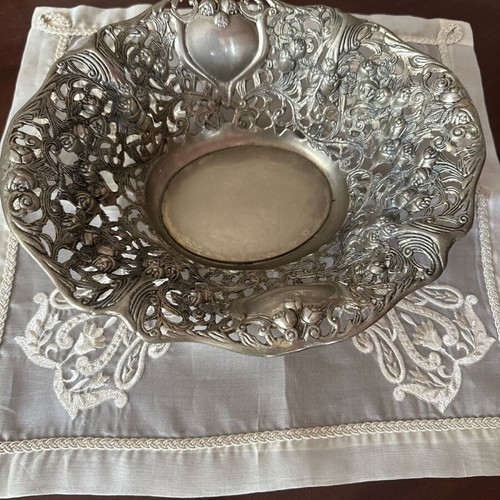 Silver centerpiece used with small bouquet of roses design
