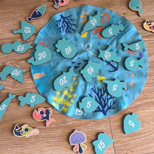 Fishing game used with wooden magnetic rods and numbered fish