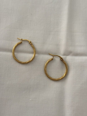 Iron golden rings with a twisted design.
