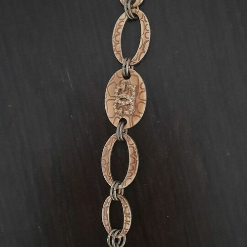 Guess vintage beige gold bracelet with rings and logo strass used