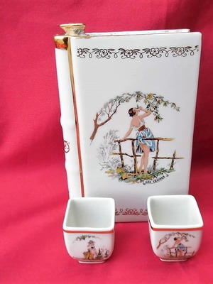Limoges France porcelain set used, three pieces cognac bottle with two glasses