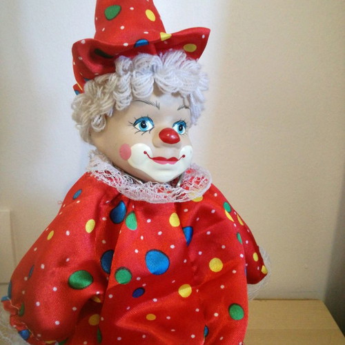 Porcelain clown used, 49cm tall, with clothes