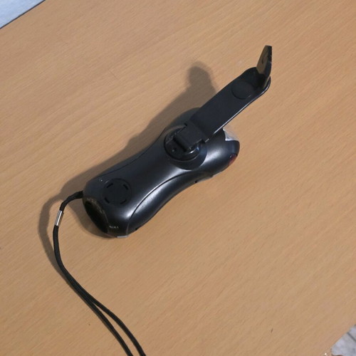 Flashlight with crank used with alarm