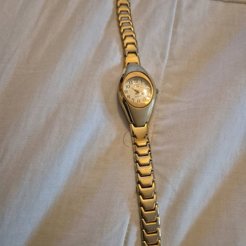 SK women's watch used, gold color