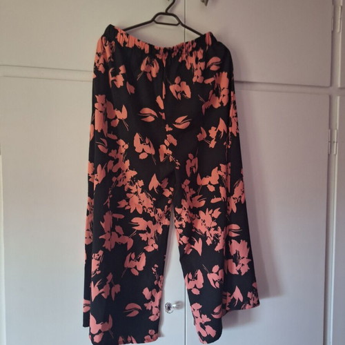 Pants new, black with pink flowers, sizes L and XL