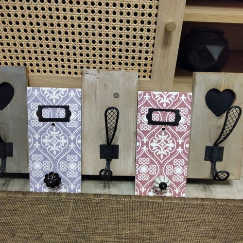 Decorative wall hanger used with wooden base and metal hooks