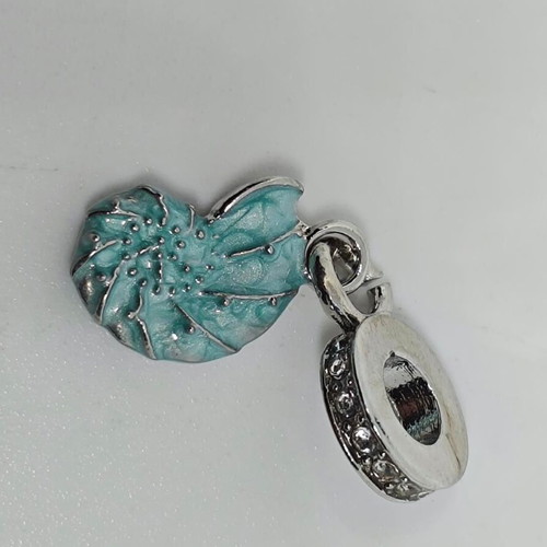 Silver charm with blue enamel Nautilus like new