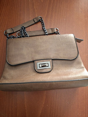 Tan crossbody bag used with minor wear