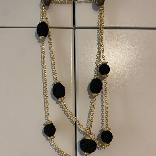 Double long necklace like new, gold tone with black knots