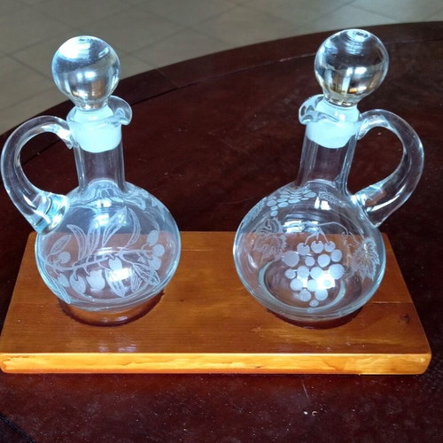 Handmade oil and vinegar set with carved glass bottles and wooden base