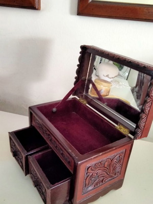 Handcrafted Peruvian jewelry box with carved wood and leather
