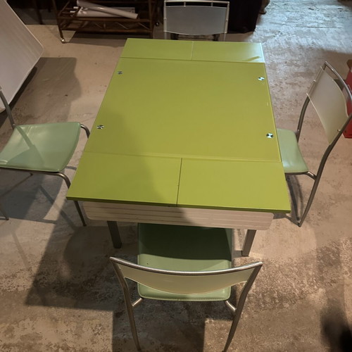 Glass dining table with extension and 4 used chairs, light green