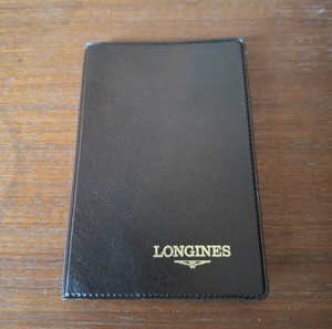 .OBSOLETE VINTAGE 1986 LONGINES MENS WATCH WARRANTY, CARD, BOOKLET, WALLET.