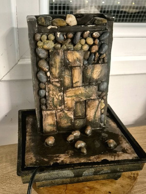 Decorative water fountain used with light