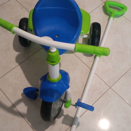 Children's tricycle bike with handle like new, blue and green