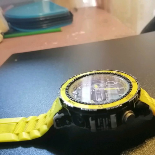 Watch with yellow strap missing one button, works