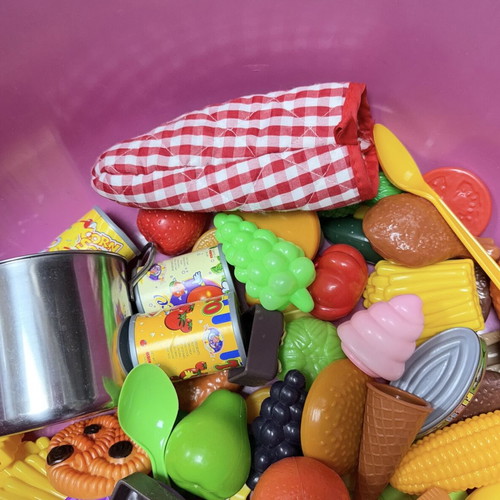 Children's toys used with plastic kitchen items, fruits, vegetables