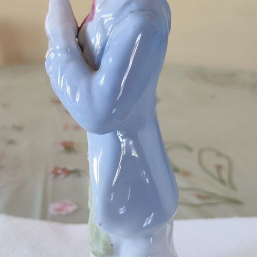 Vintage porcelain figurine Victorian man with bird and cage