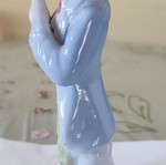 Vintage porcelain figurine Victorian man with bird and cage