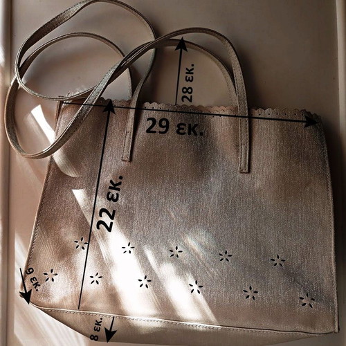 Women's shoulder bag metallic silver with flower cutouts