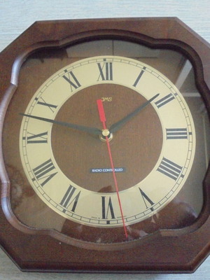 Wall clock radio controlled used with wooden frame and Roman numerals