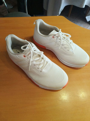 White athletic shoes like new with orange sole size 44