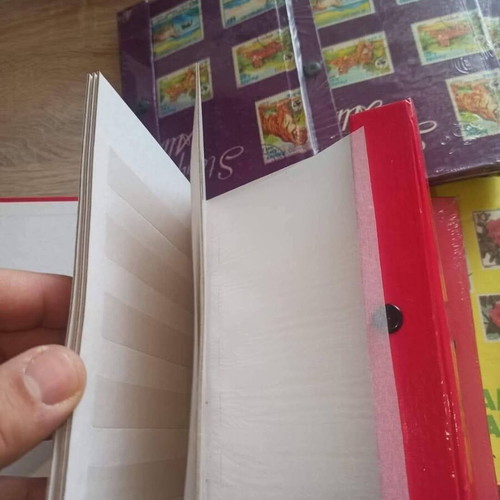 Stamp album new, 8 leaves, 16 pages