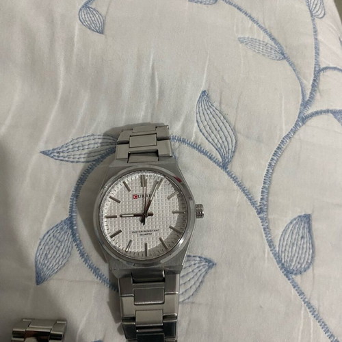 Silver watch with white dial like new