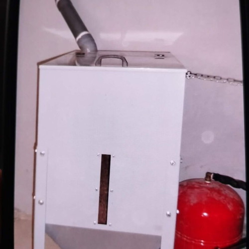 Pellet and wood boiler used with silo