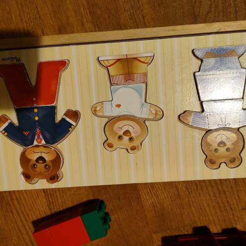 Melissa and Doug wooden puzzle like new with 3 figures and clothes