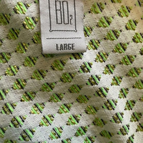 BO2 sleeveless A-line dress with green geometric brocade pattern