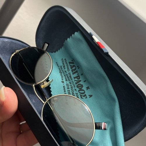 Tommy Hilfiger sunglasses with gold frame and dark lenses