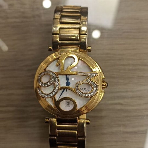 Vogue wristwatch like new, gold stainless steel with decorative stones
