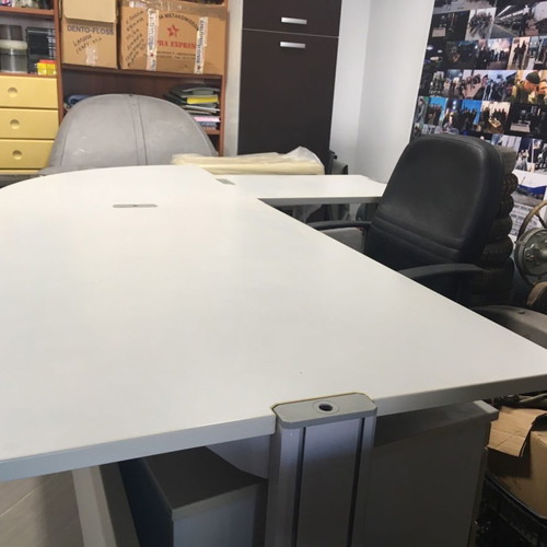 Corner desk used with adjustable height, chair and drawer unit