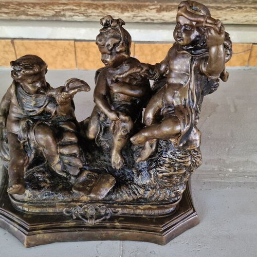 Bronze sculpture of three children putti, used